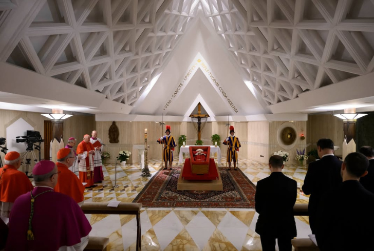 Cardinal leads prayer inside basilica