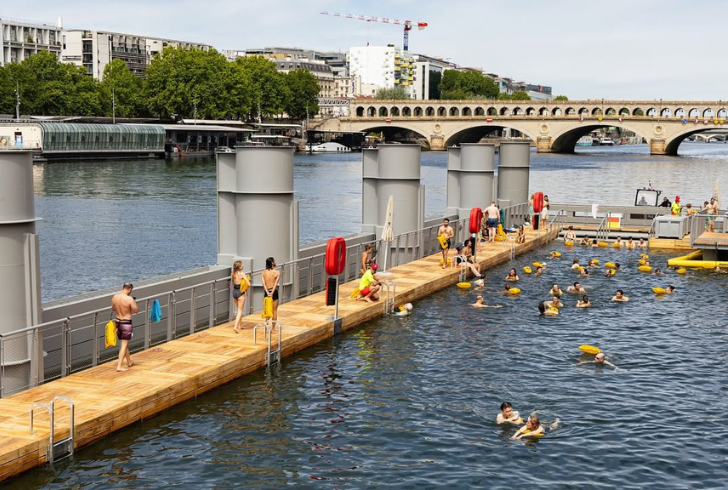 People swim near Eiffel Tower
